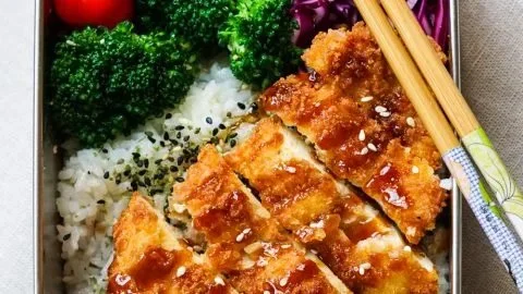 Crave-worthy Chicken Katsu Bento Box with crispy chicken fillet and rice.