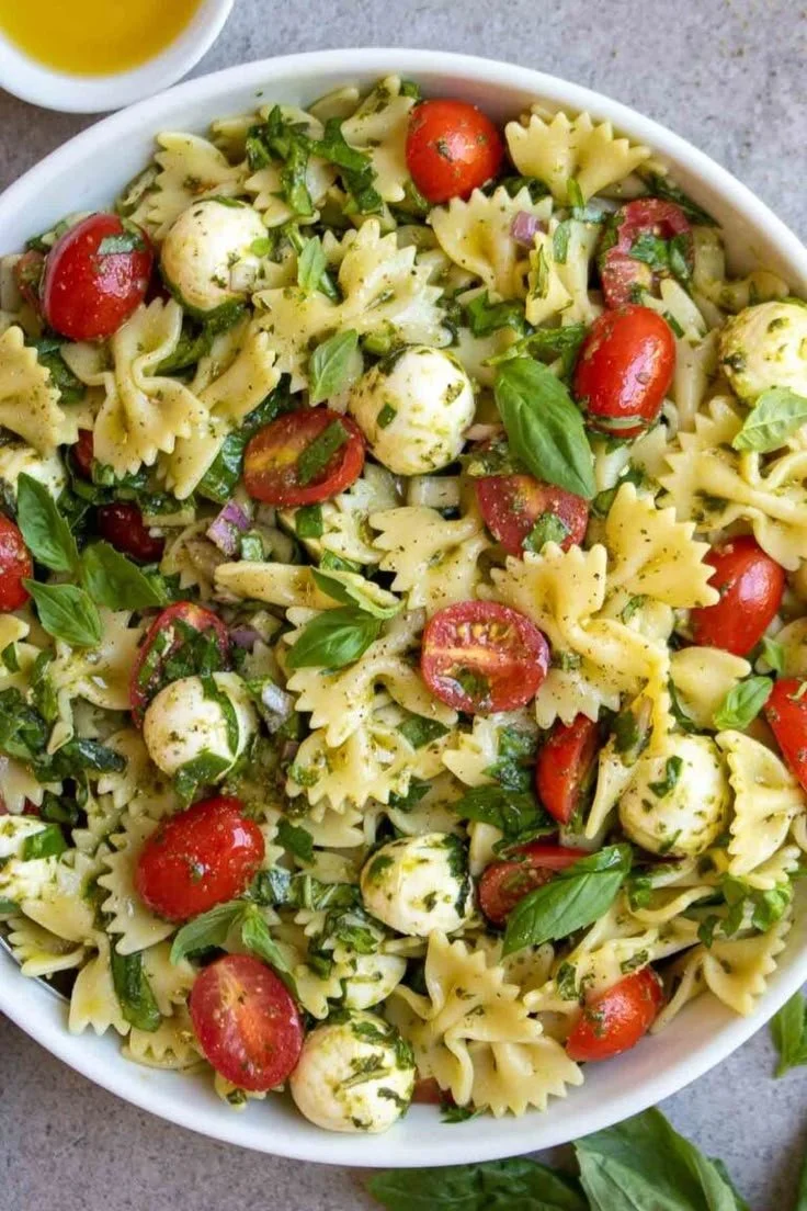 Colorful and vibrant bow tie pasta salad with fresh vegetables