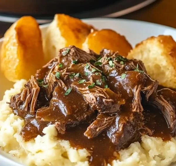 Delicious Beef Manhattan served with savory gravy and vegetables.