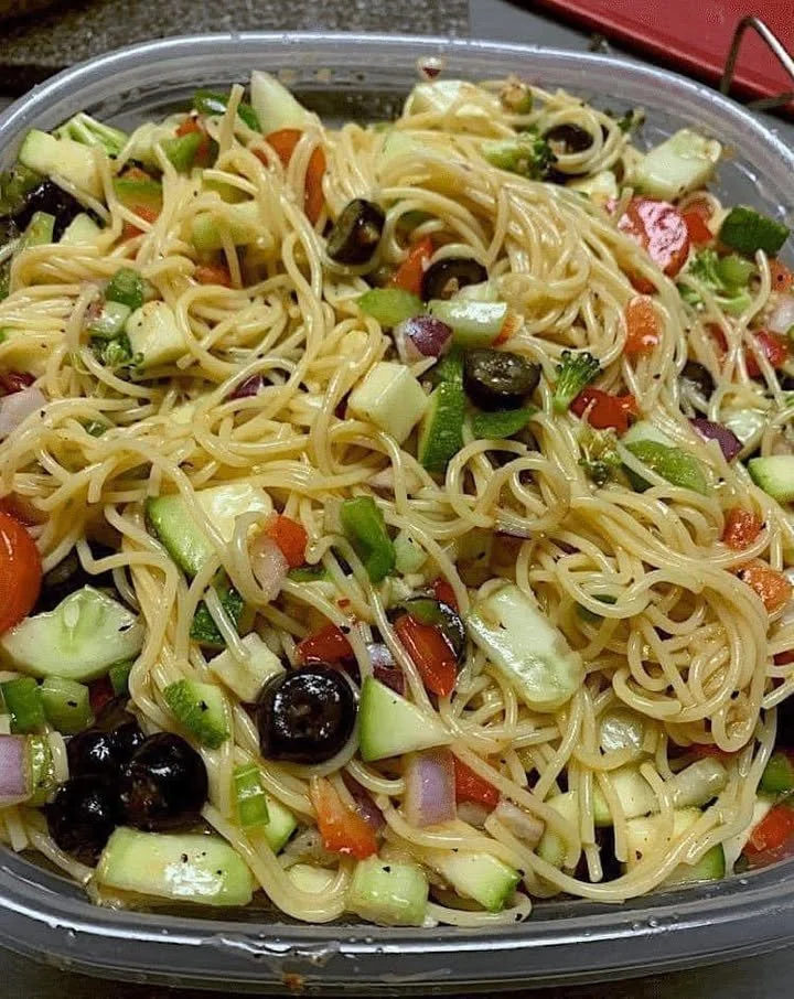 Colorful, fresh salad with vibrant vegetables and dressing on a plate