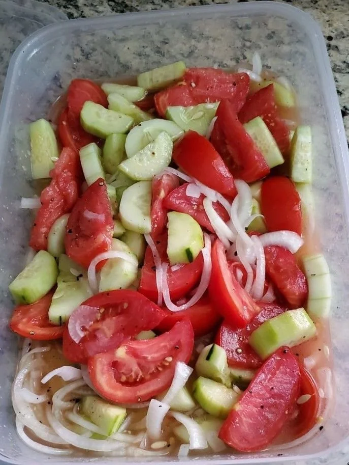 Colorful refrigerator salad loaded with fresh vegetables and healthy ingredients.